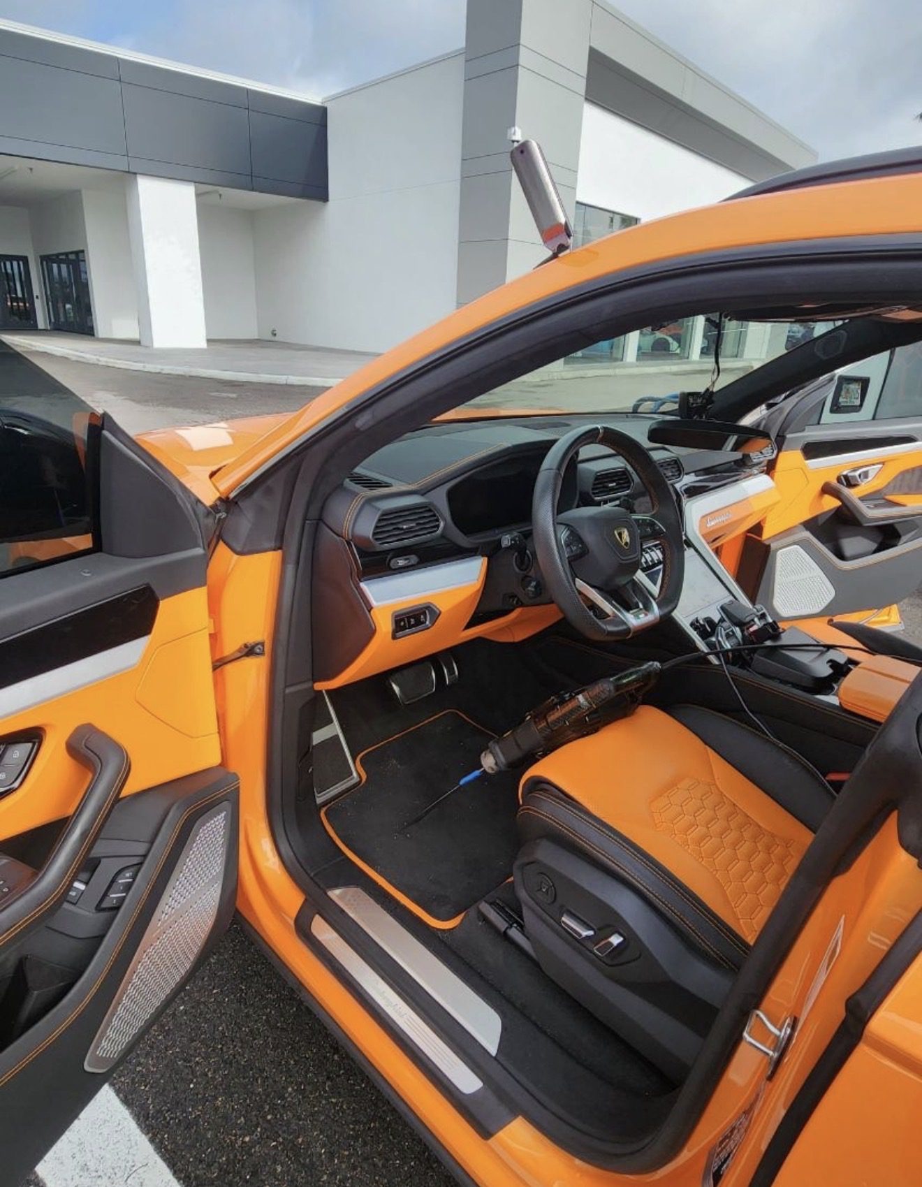Lamborghini Urus interior during a windshield replacement